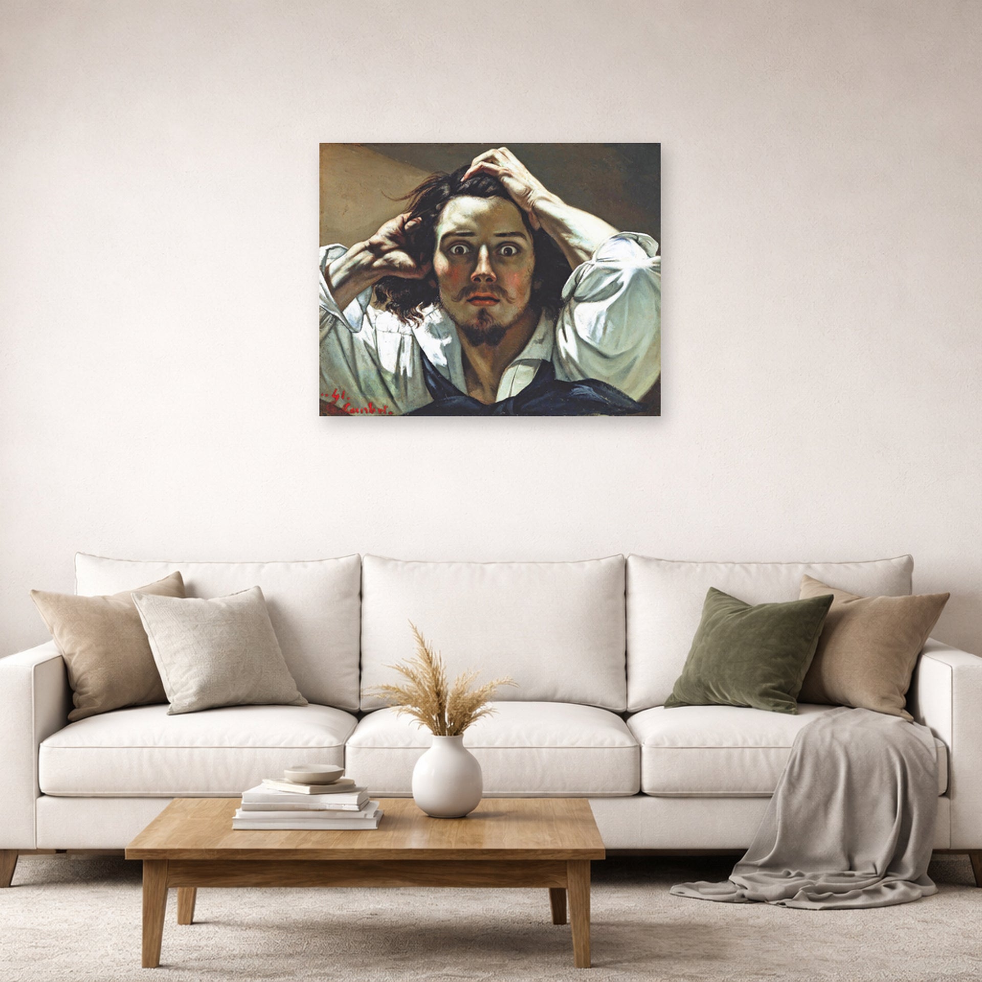 Unframed poster print of Gustave Courbet's Selfportrait (The Desperate Man) displayed on a wall in a living room