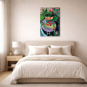 Gallery-wrapped canvas print of Henri Matisse's Artist and Goldfish hanging above a bed in a bedroom