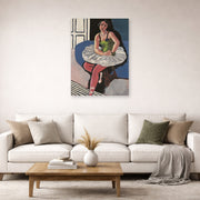 Unframed poster print of Henri Matisse's Ballet Dancer Seated on a Stool displayed in a living room, view 2