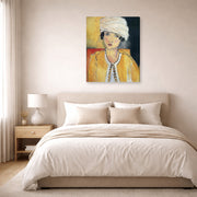 Gallery-wrapped canvas print of Henri Matisse's Lorette with Turban and Yellow Vest hanging above a bed in a bedroom