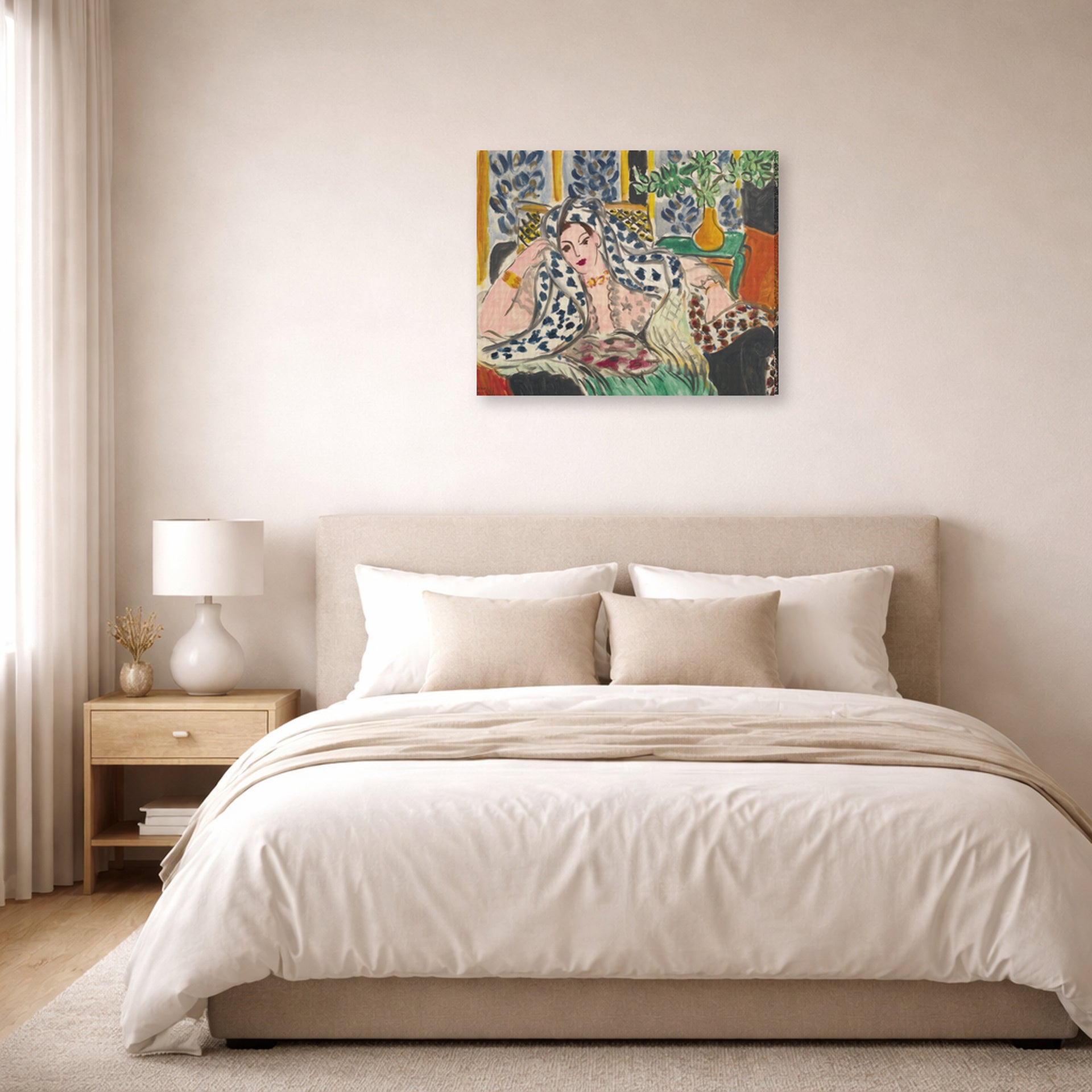 Gallery-wrapped canvas print of Henri Matisse's Odalisque Au Fauteuil Noir hanging above a bed in a bedroom