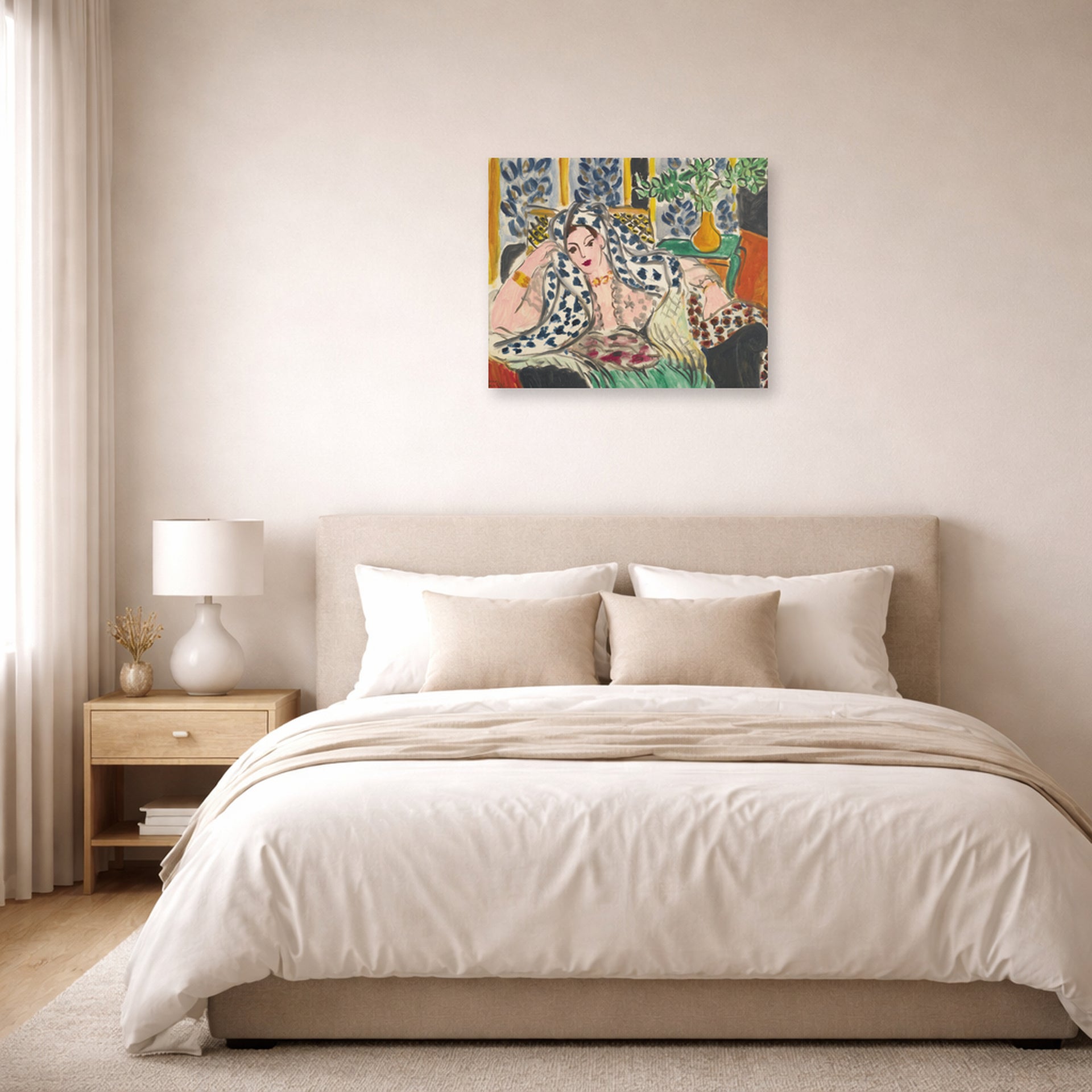 Unframed poster print of Henri Matisse's Odalisque Au Fauteuil Noir displayed above a bed in a bedroom