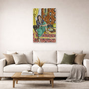 Unframed poster print of Henri Matisse's Odalisque Sitting With Board displayed in a living room, view 2
