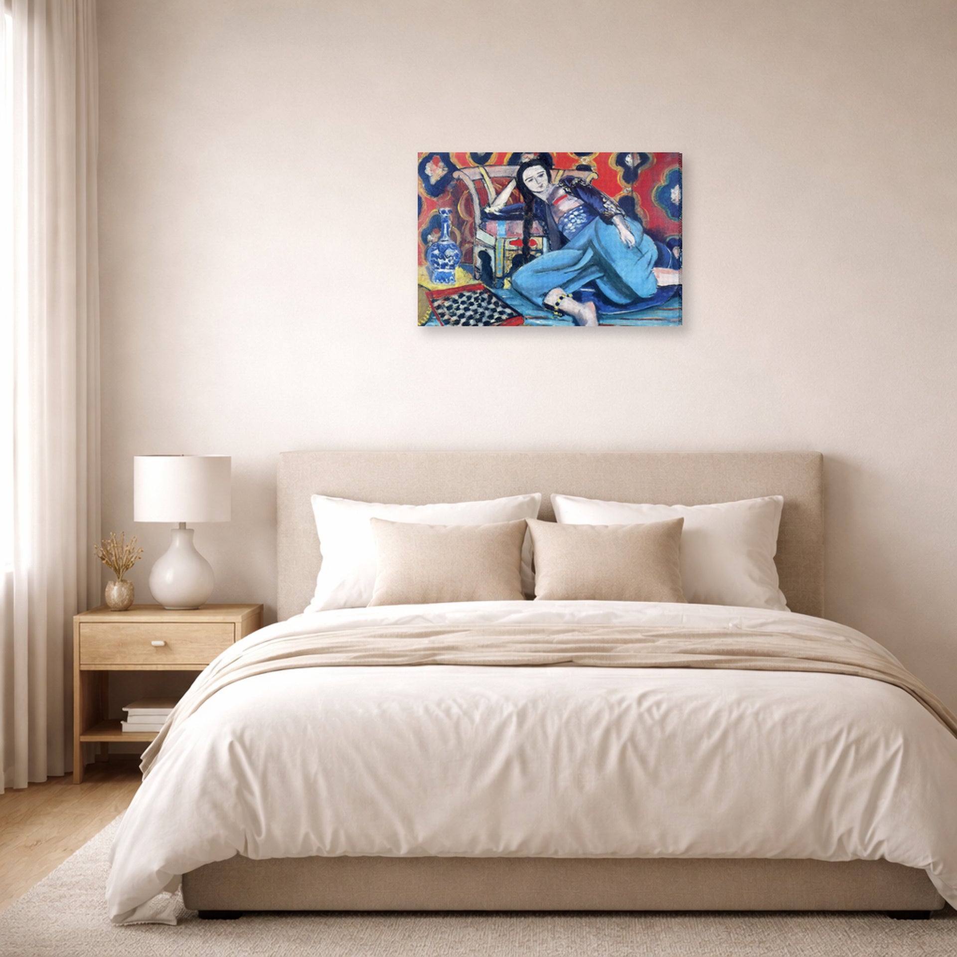 Gallery-wrapped canvas print of Henri Matisse's Odalisque with a Turkish Chair hanging above a bed in a bedroom