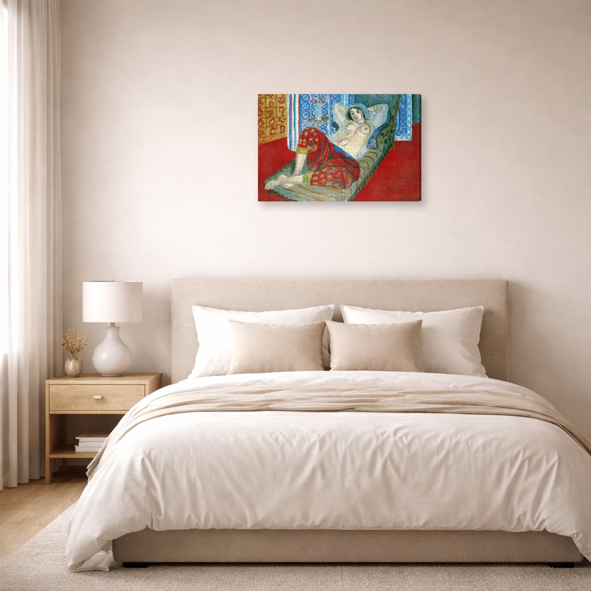 Gallery-wrapped canvas print of Henri Matisse's Odalisque in Red Culottes hanging above a bed in a bedroom