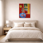 Gallery-wrapped canvas print of Henri Matisse's Red Interior Still Life on a Blue Table hanging above a bed in a bedroom