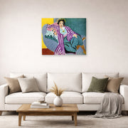 Unframed poster print of Henri Matisse's Small Odalisque in Purple Robe displayed in a living room, view 2