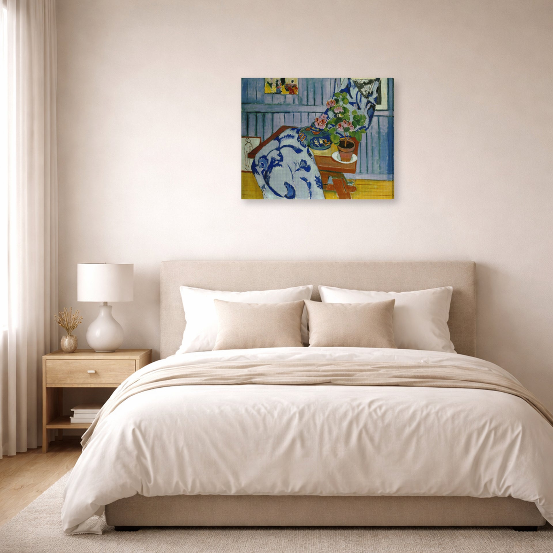 Gallery-wrapped canvas print of Henri Matisse's Still Life with Geraniums hanging above a bed in a bedroom