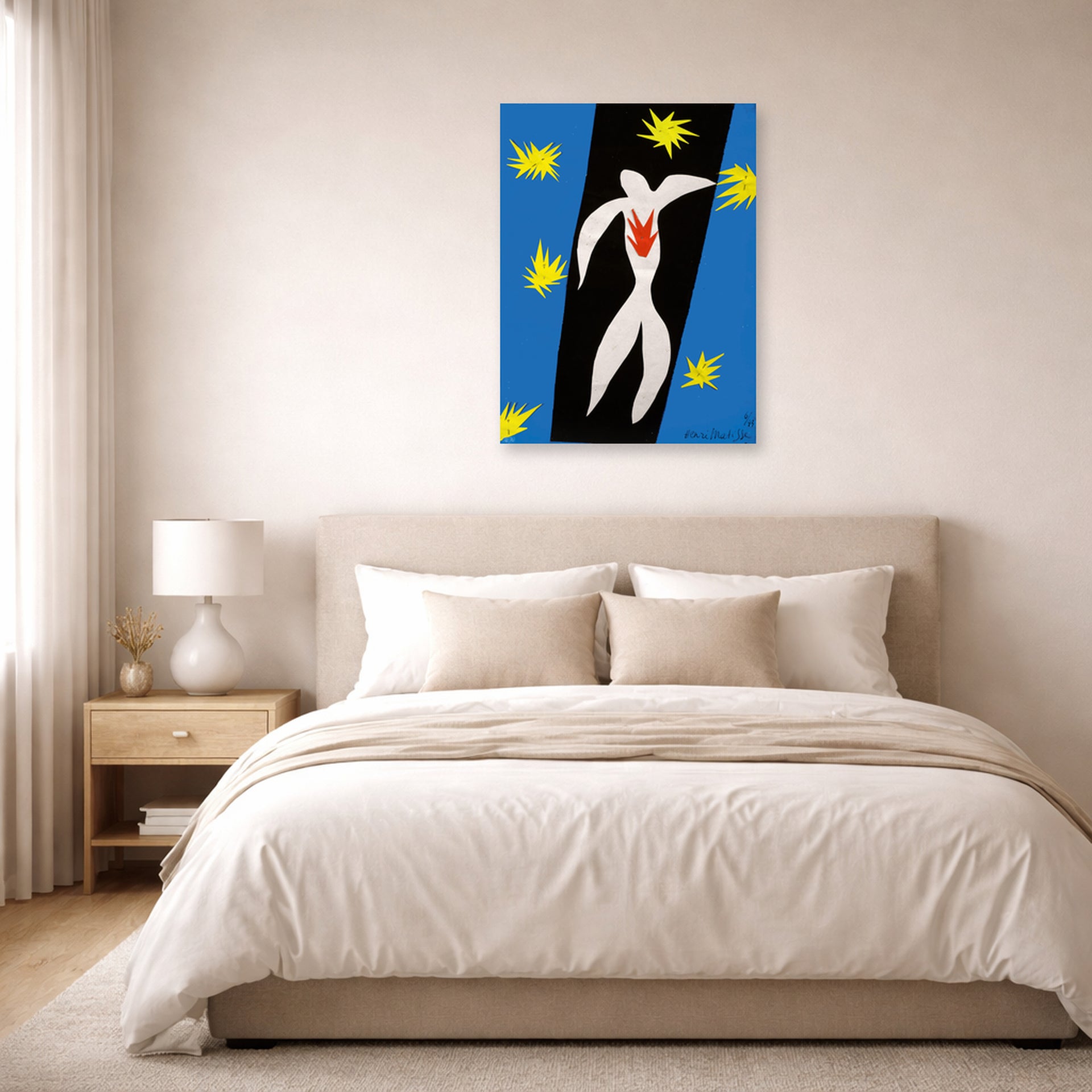 Unframed poster print of Henri Matisse's The Fall of Icarus displayed above a bed in a bedroom