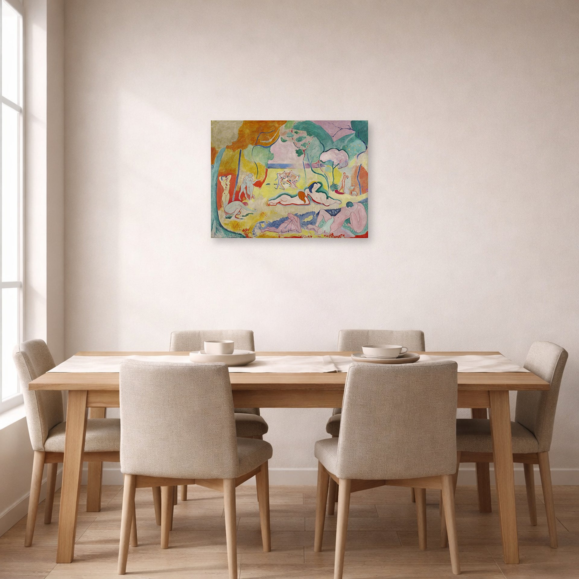 Unframed poster print of Henri Matisse's The Joy of Life displayed on a dining room wall