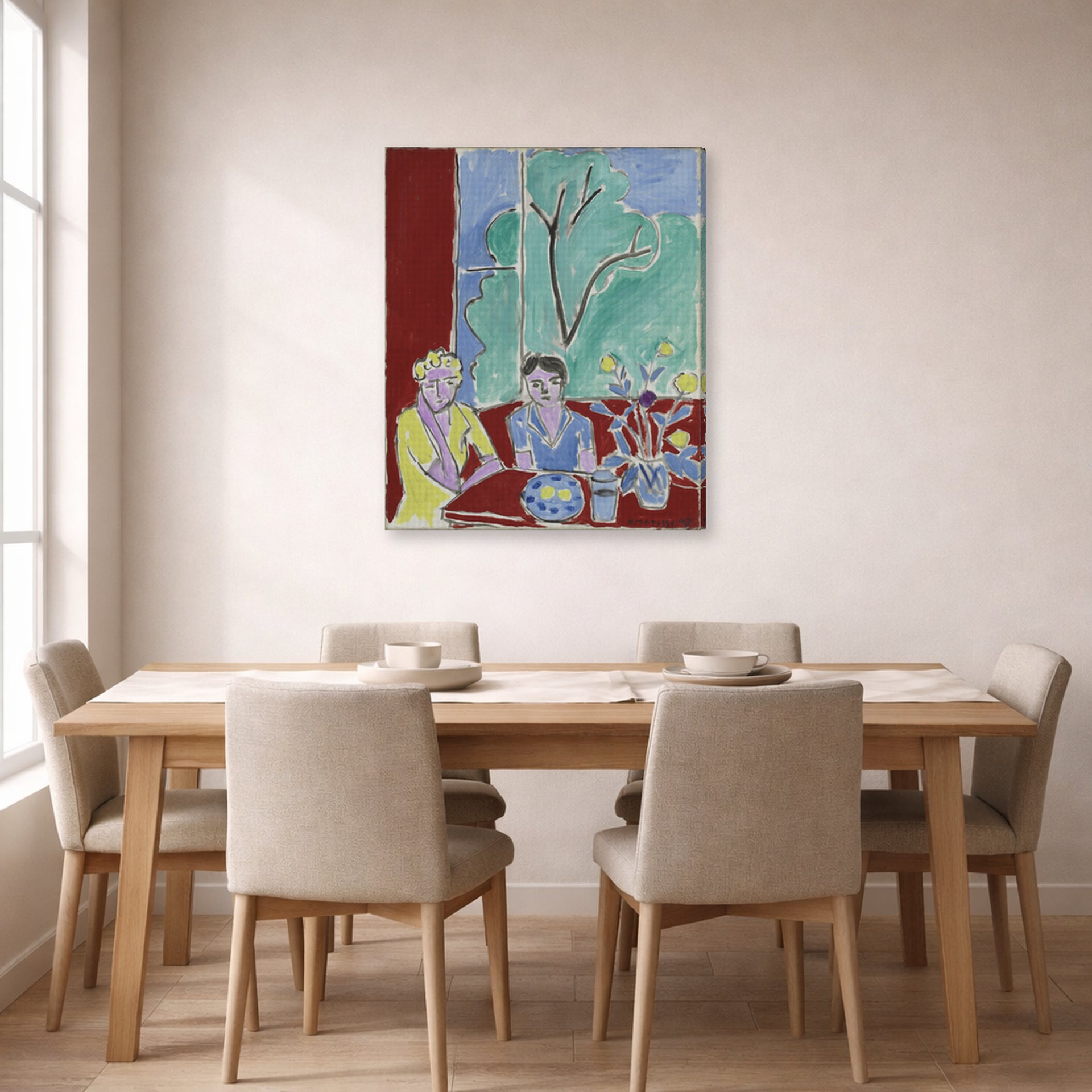Gallery-wrapped canvas print of Henri Matisse's Two Girls, Red and Green Background hanging on a dining room wall