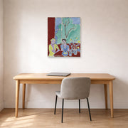 Unframed poster print of Henri Matisse's Two Girls, Red and Green Background displayed in a home office