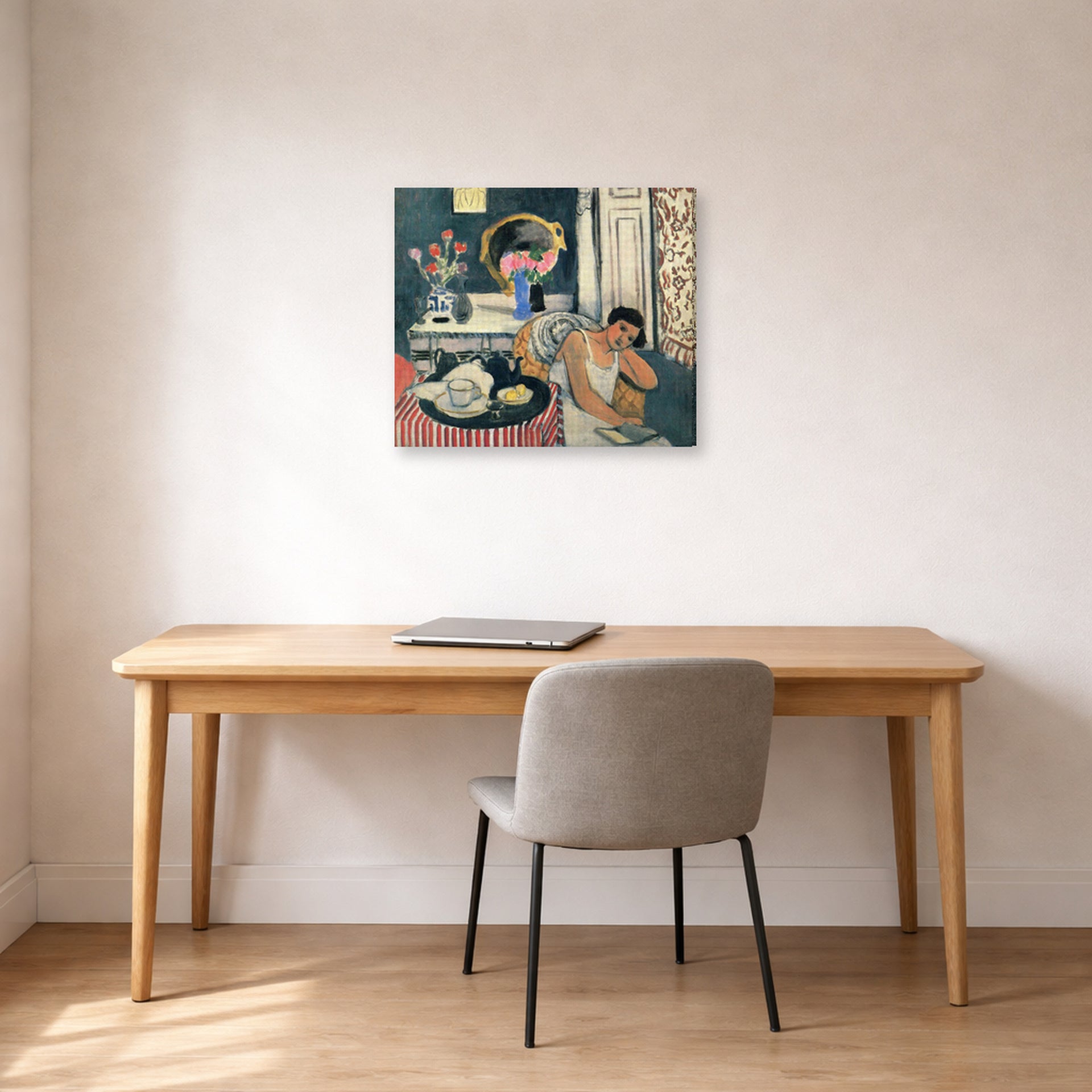 Gallery-wrapped canvas print of Henri Matisse's Woman Reading hanging in a home office