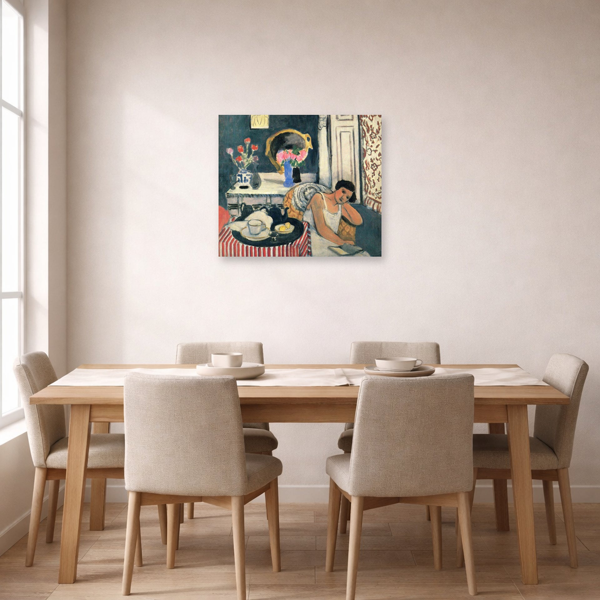 Unframed poster print of Henri Matisse's Woman Reading displayed on a dining room wall