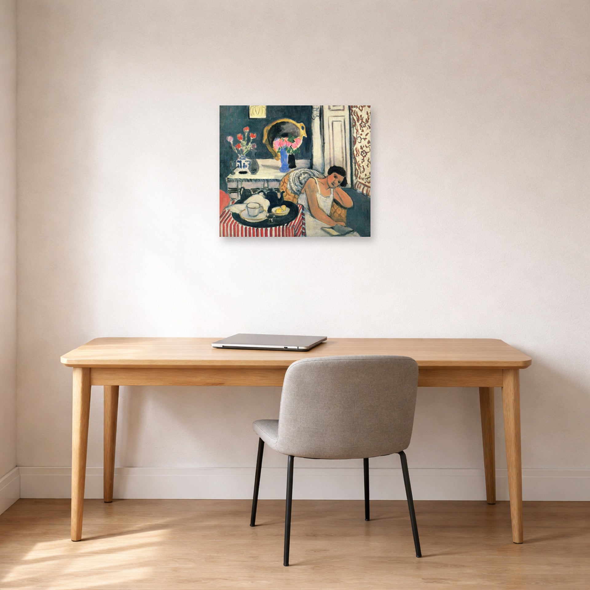 Unframed poster print of Henri Matisse's Woman Reading displayed in a home office
