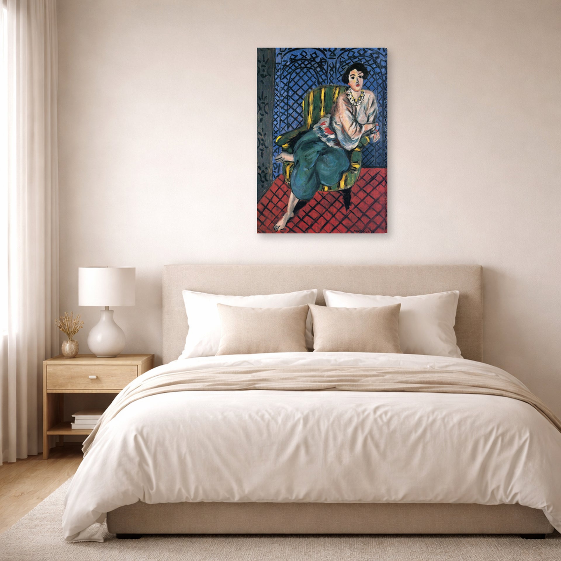 Gallery-wrapped canvas print of Henri Matisse's Woman Sitting in a Chair hanging above a bed in a bedroom