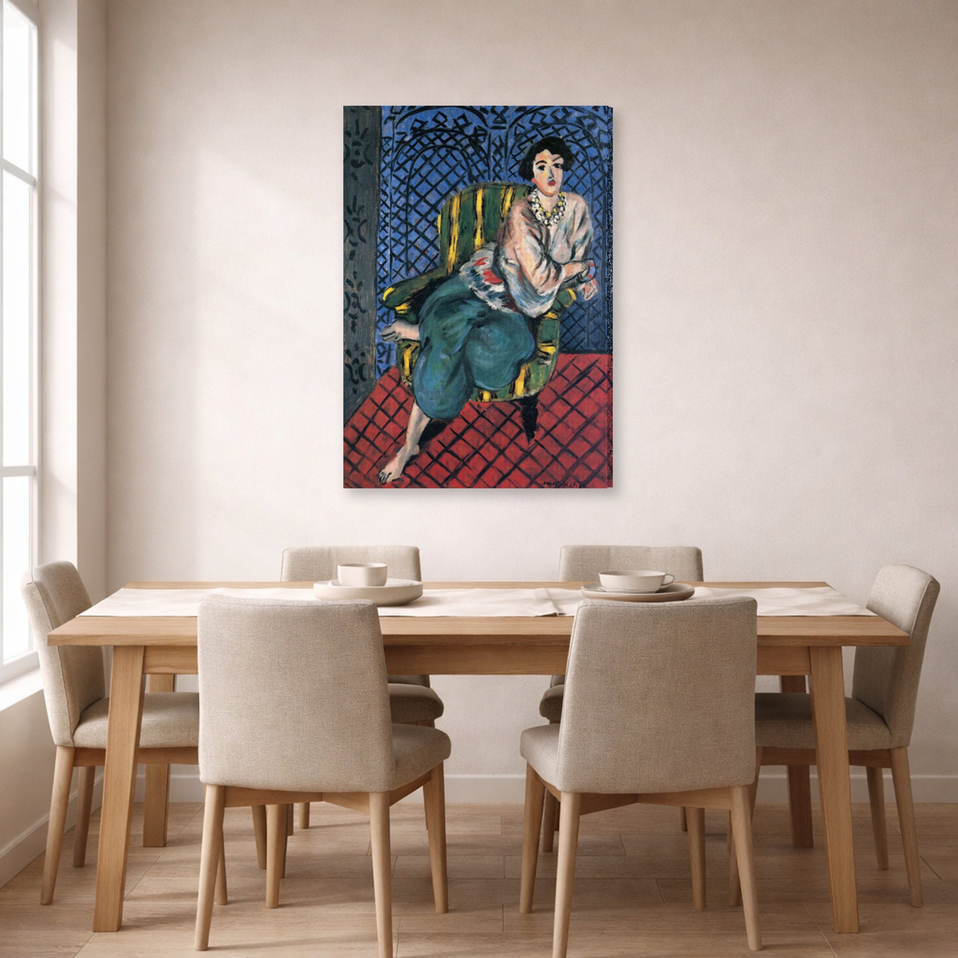 Gallery-wrapped canvas print of Henri Matisse's Woman Sitting in a Chair hanging on a dining room wall