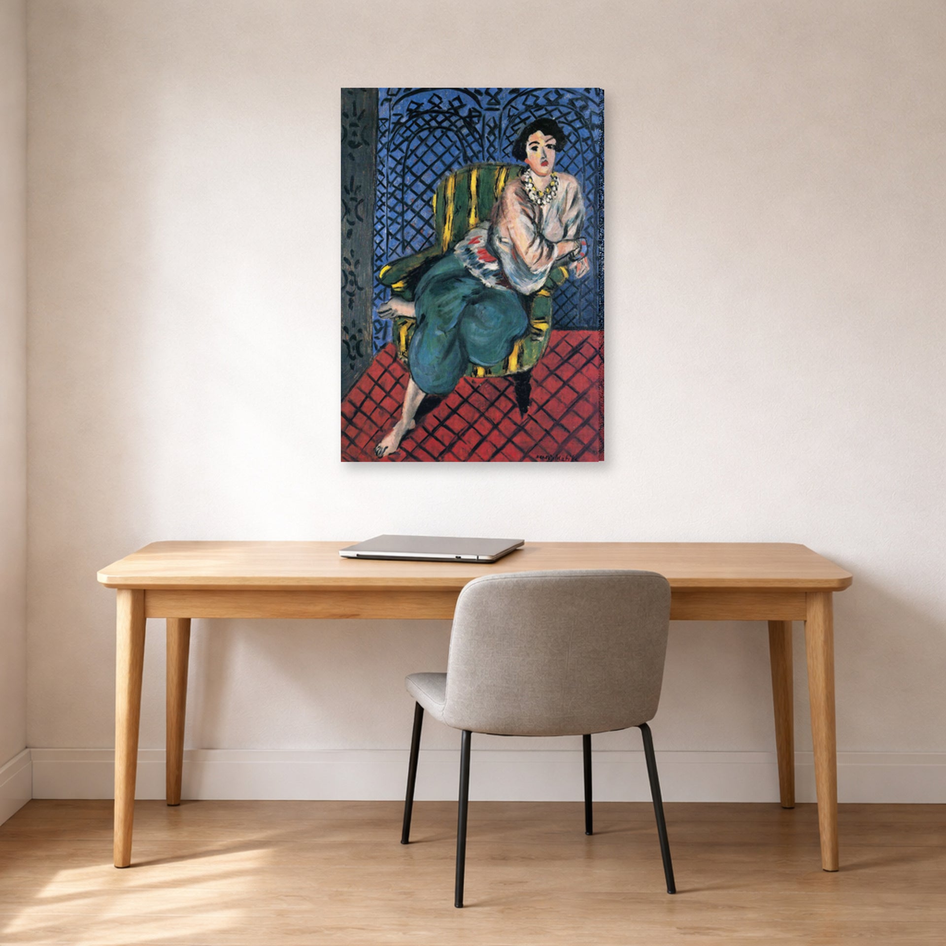 Gallery-wrapped canvas print of Henri Matisse's Woman Sitting in a Chair hanging in a home office