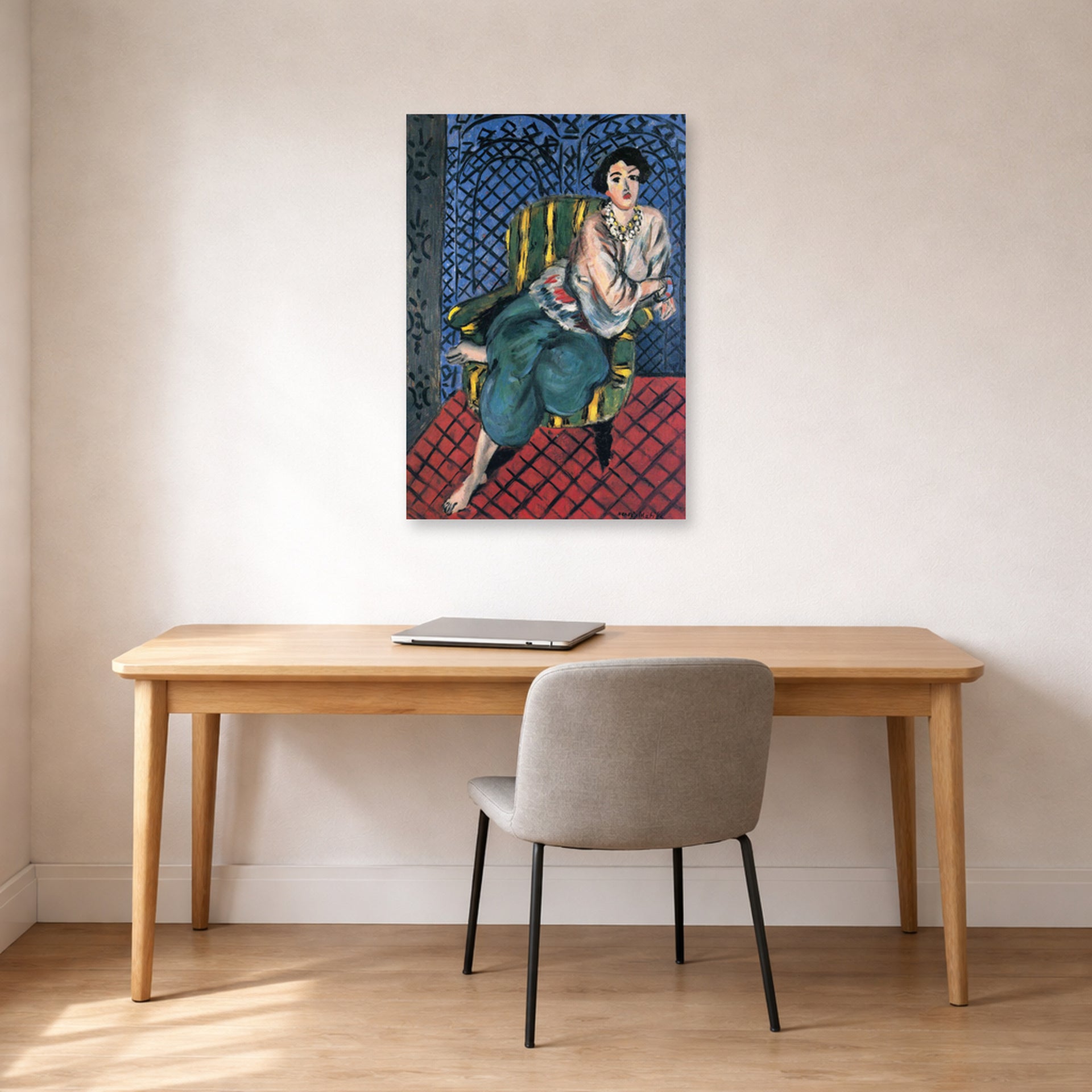 Unframed poster print of Henri Matisse's Woman Sitting in a Chair displayed in a home office