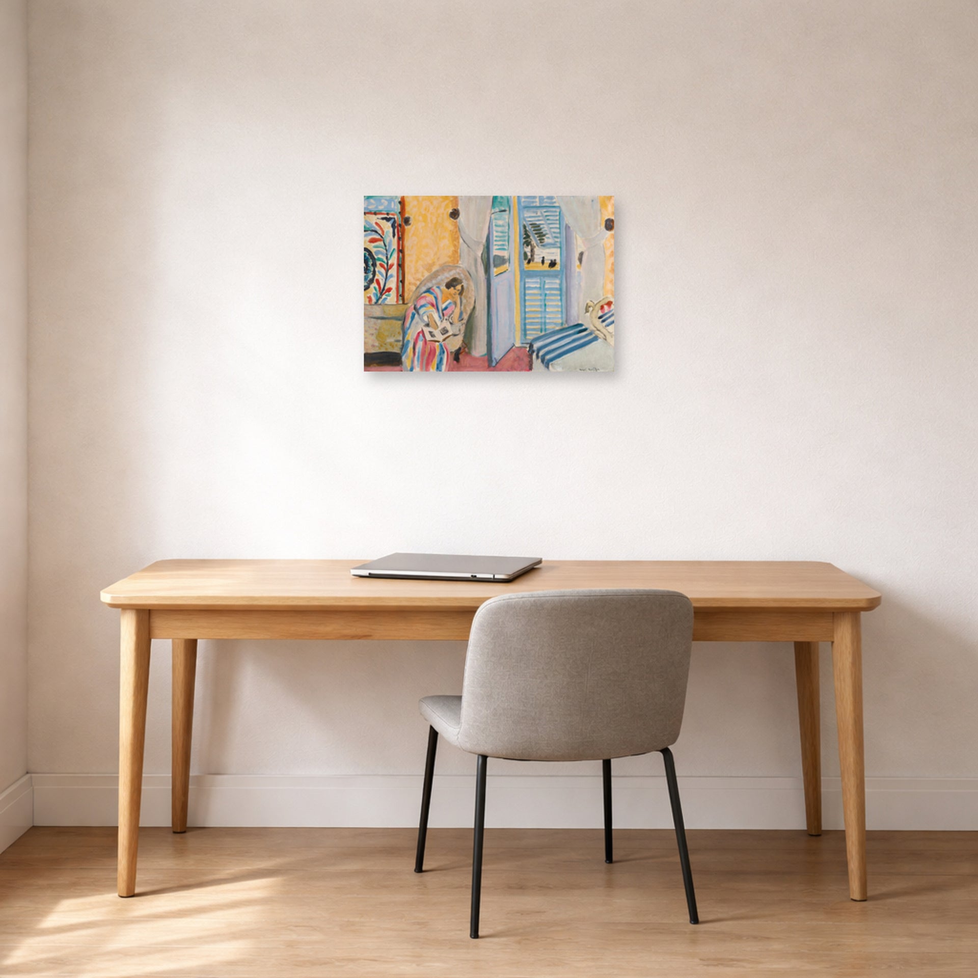 Unframed poster print of Henri Matisse's Woman with a Book displayed in a home office