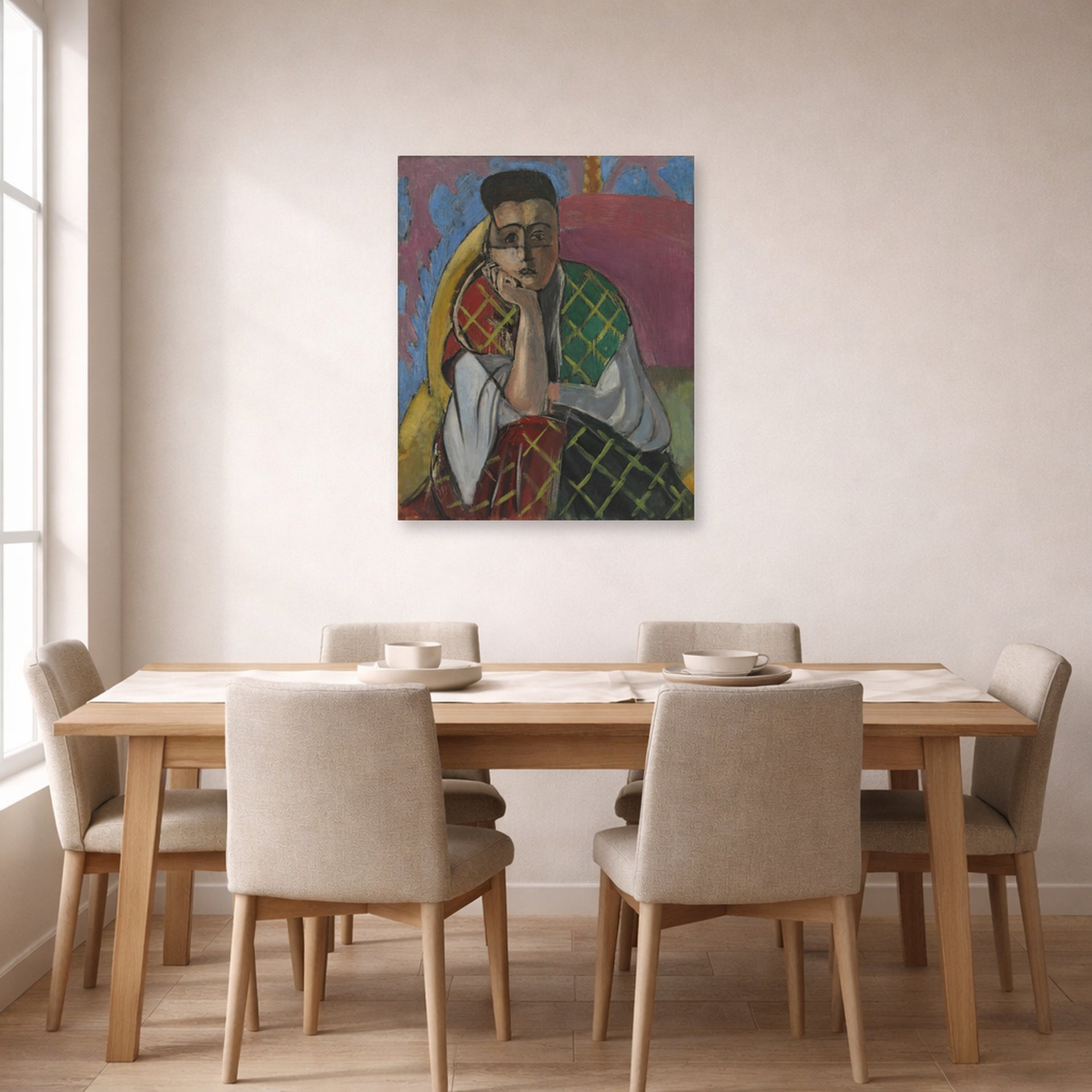 Unframed poster print of Henri Matisse's Woman with a Veil displayed on a dining room wall
