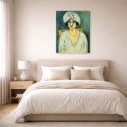Gallery-wrapped canvas print of Henri Matisse's Woman in Turban hanging above a bed in a bedroom