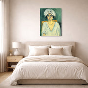 Unframed poster print of Henri Matisse's Woman in Turban displayed above a bed in a bedroom