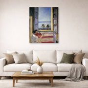 Gallery-wrapped canvas print of Henri Matisse's Young Woman Playing Violin hanging in a living room, view 2