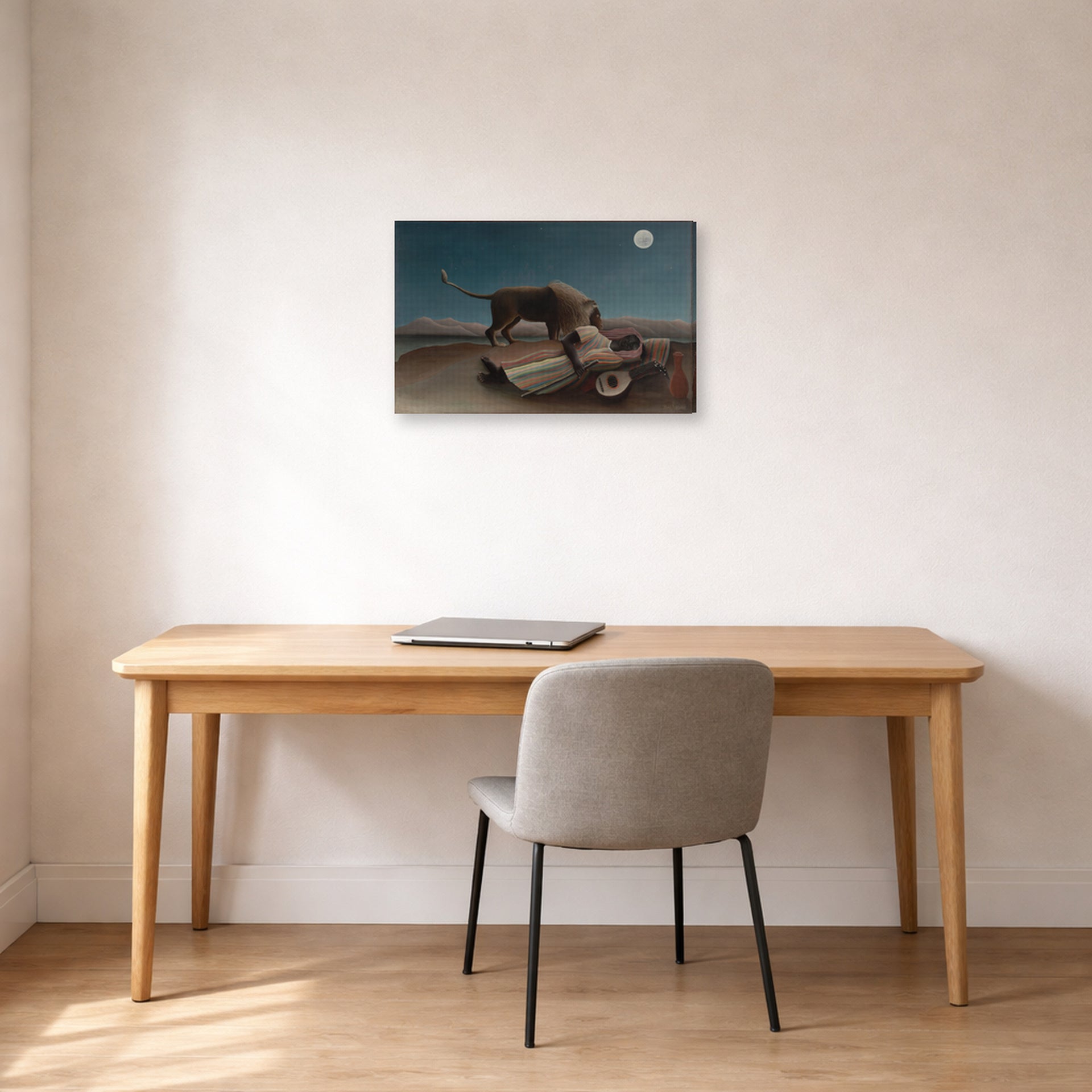 Gallery-wrapped canvas print of Henri Rousseau's La Bohémienne endormie, The Sleeping Gypsy displayed on a wall in a home office