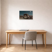Unframed poster print of Henri Rousseau's La Bohémienne endormie, The Sleeping Gypsy displayed on a wall in a home office