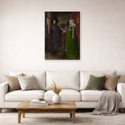Unframed poster print of Jan van Eyck's 'Portrait of Giovanni Arnolfini and his Wife' displayed on a wall in a living room