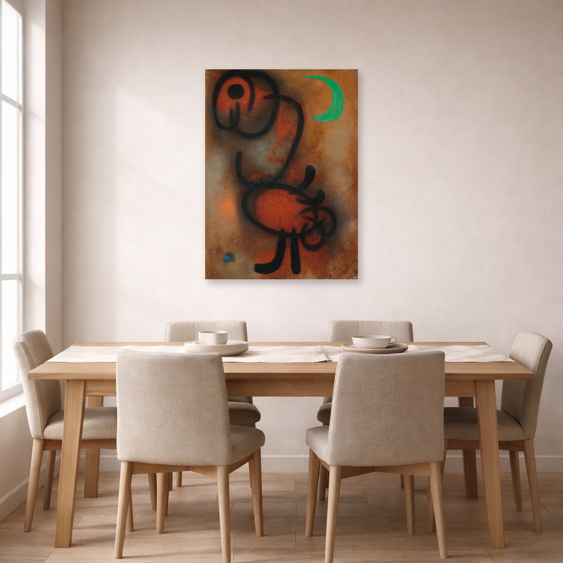 Unframed poster print of Joan Miró's 'Bird' displayed on a wall in a dining room