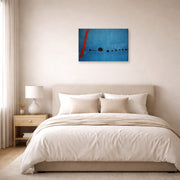 Gallery-wrapped canvas print of Joan Miró's 'Blue' displayed on a wall in a bedroom