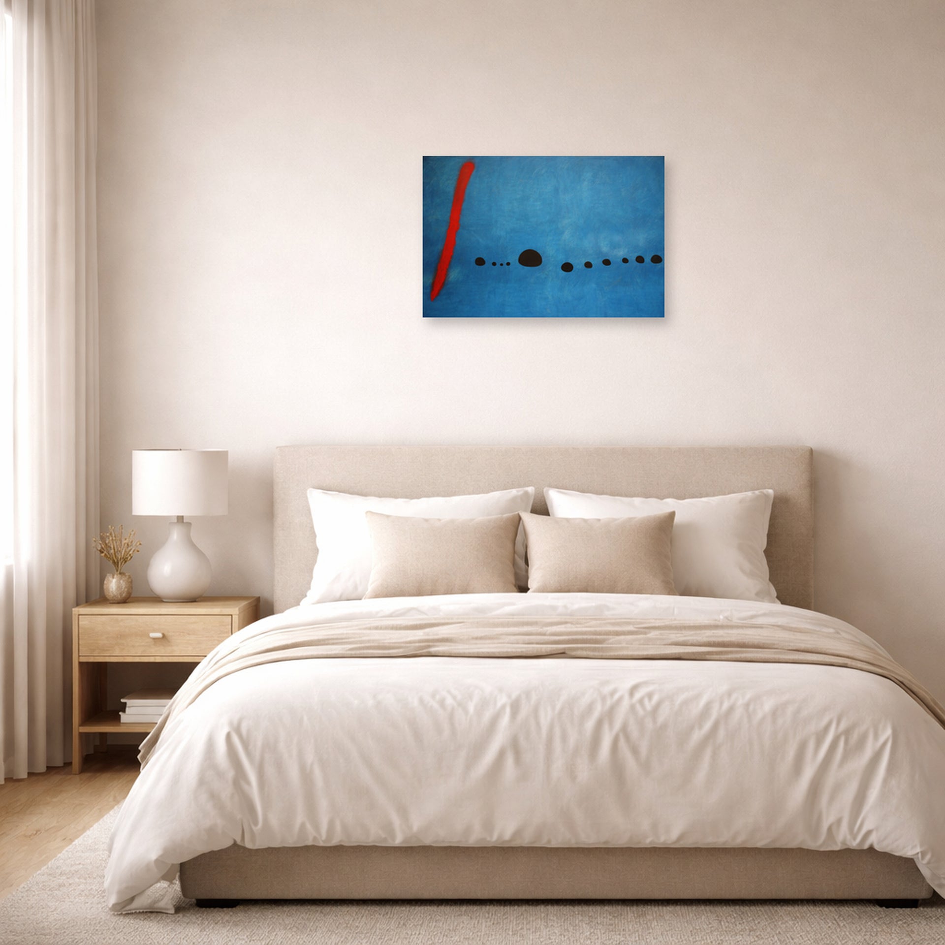 Unframed poster print of Joan Miró's 'Blue' displayed on a wall in a bedroom