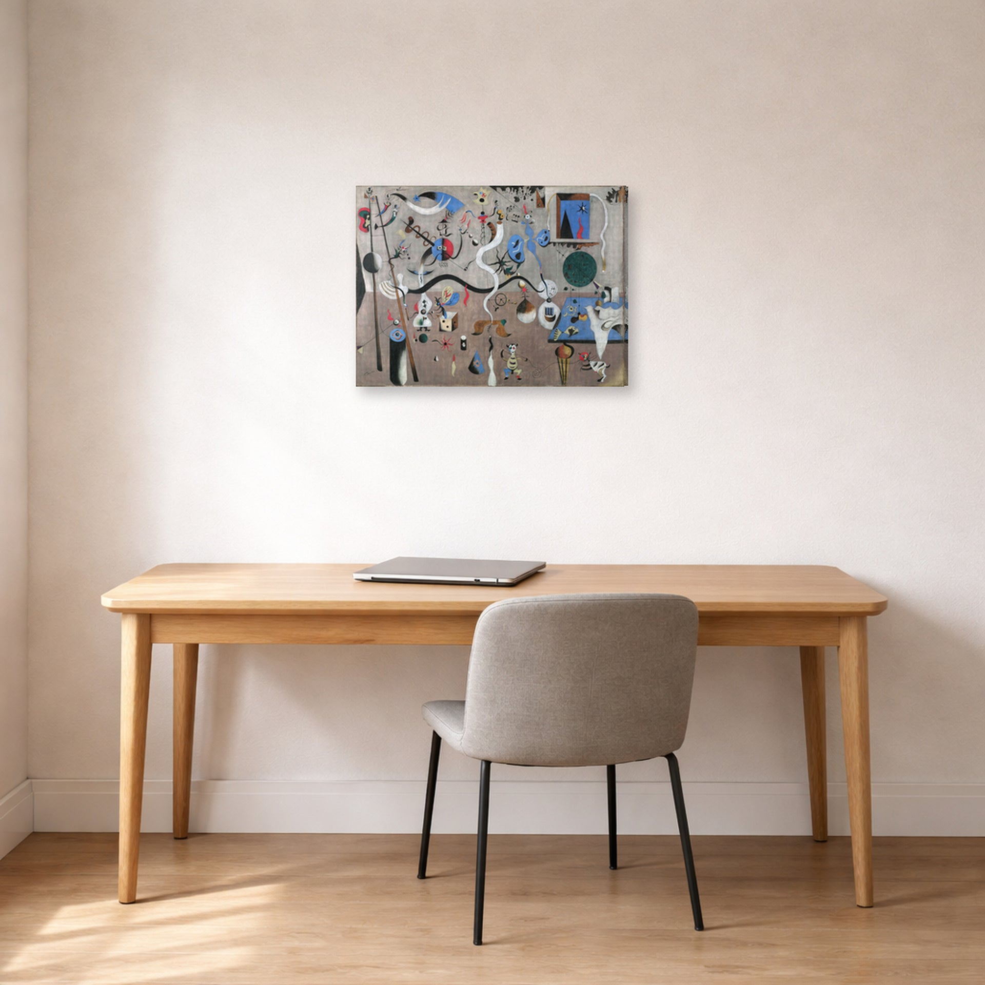 Gallery-wrapped canvas print of Joan Miró's 'Carnival of Harlequin' displayed on a wall in a office