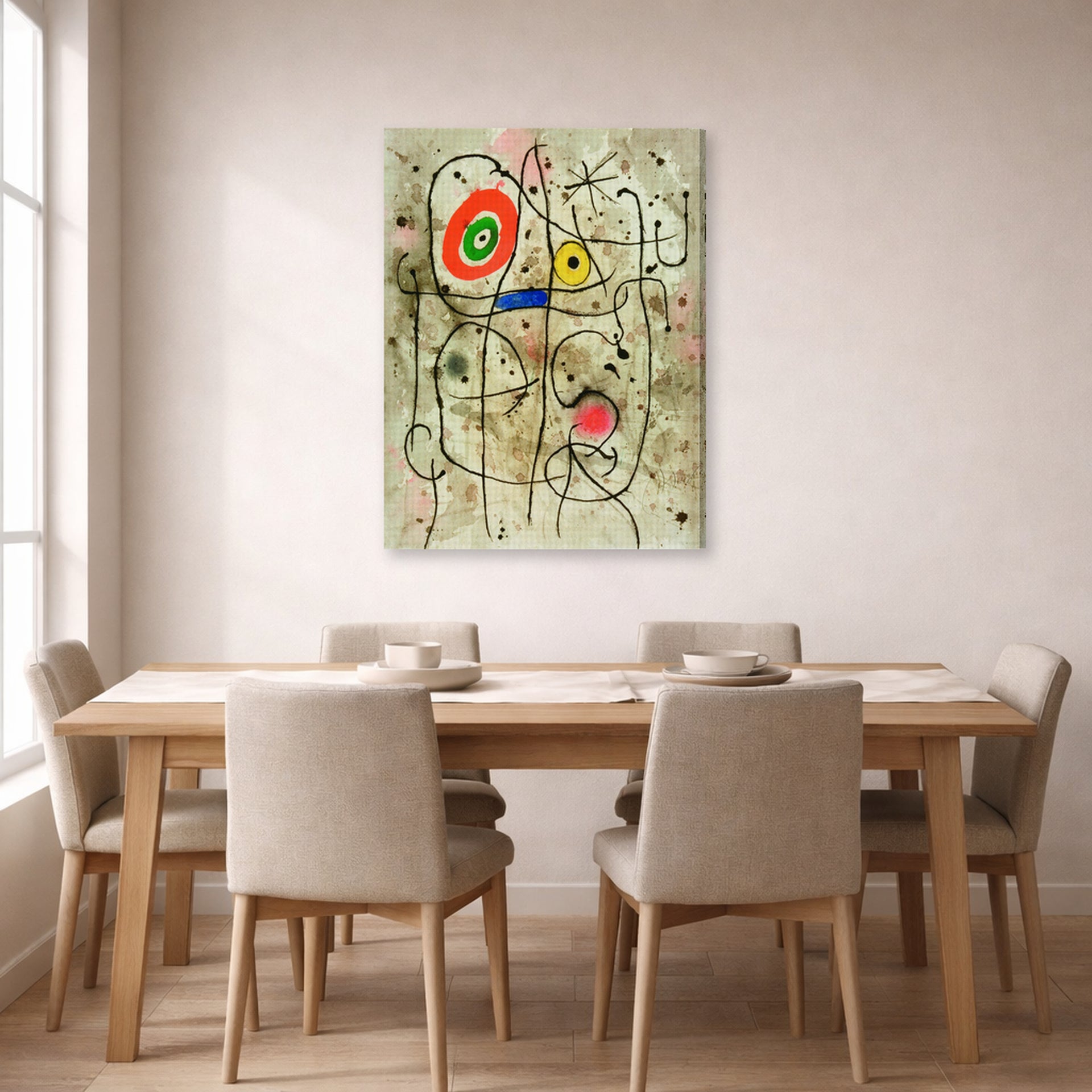 Gallery-wrapped canvas print of Joan Miró's 'Composition Au Visage' displayed on a wall in a dining room