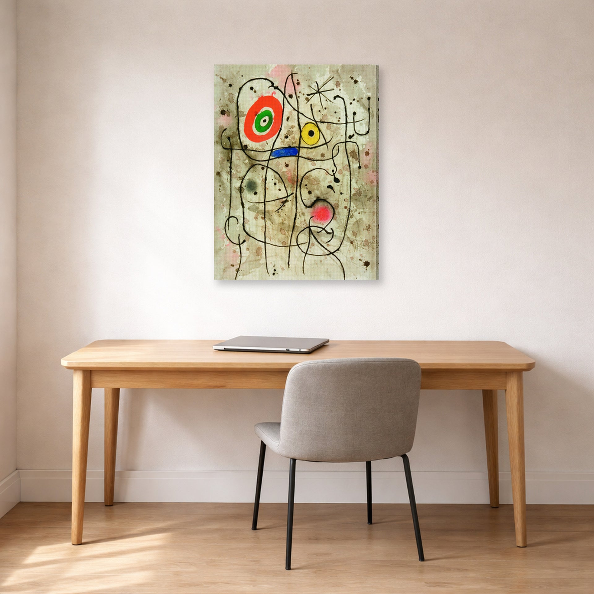 Gallery-wrapped canvas print of Joan Miró's 'Composition Au Visage' displayed on a wall in a office