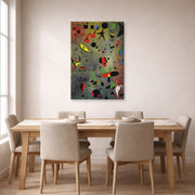 Gallery-wrapped canvas print of Joan Miró's 'Constellation Awakening at Dawn' displayed on a wall in a dining room