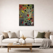 Gallery-wrapped canvas print of Joan Miró's 'Constellation Awakening at Dawn' displayed on a wall in a living room