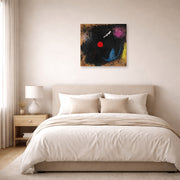 Unframed poster print of Joan Miró's 'Dancer in Front of the Sun' displayed on a wall in a bedroom