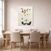 Gallery-wrapped canvas print of Joan Miró's 'Emme Revant De L'evasion' displayed on a wall in a dining room