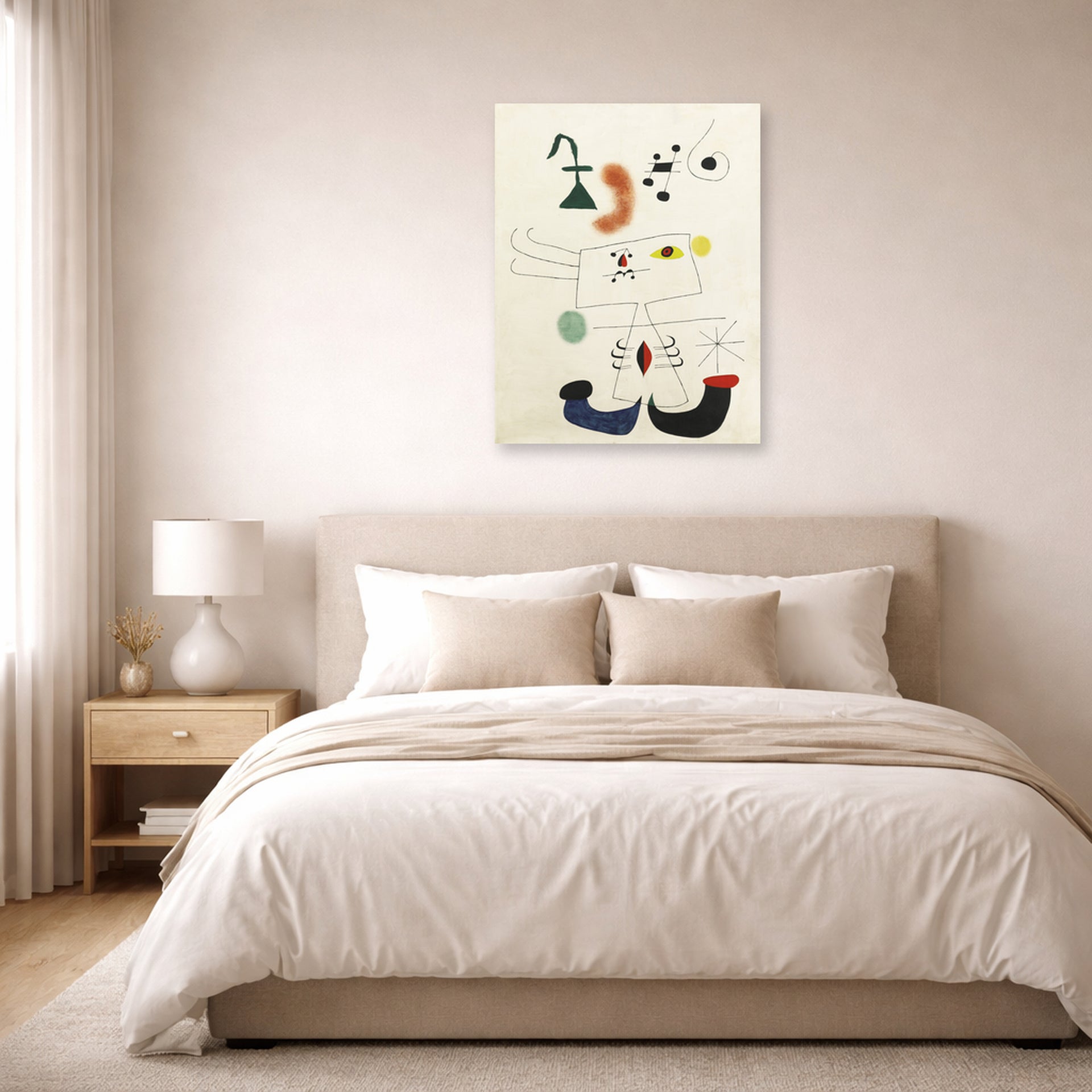 Unframed poster print of Joan Miró's 'Emme Revant De L'evasion' displayed on a wall in a bedroom