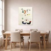 Unframed poster print of Joan Miró's 'Emme Revant De L'evasion' displayed on a wall in a dining room