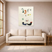 Unframed poster print of Joan Miró's 'Emme Revant De L'evasion' displayed on a wall in a living room