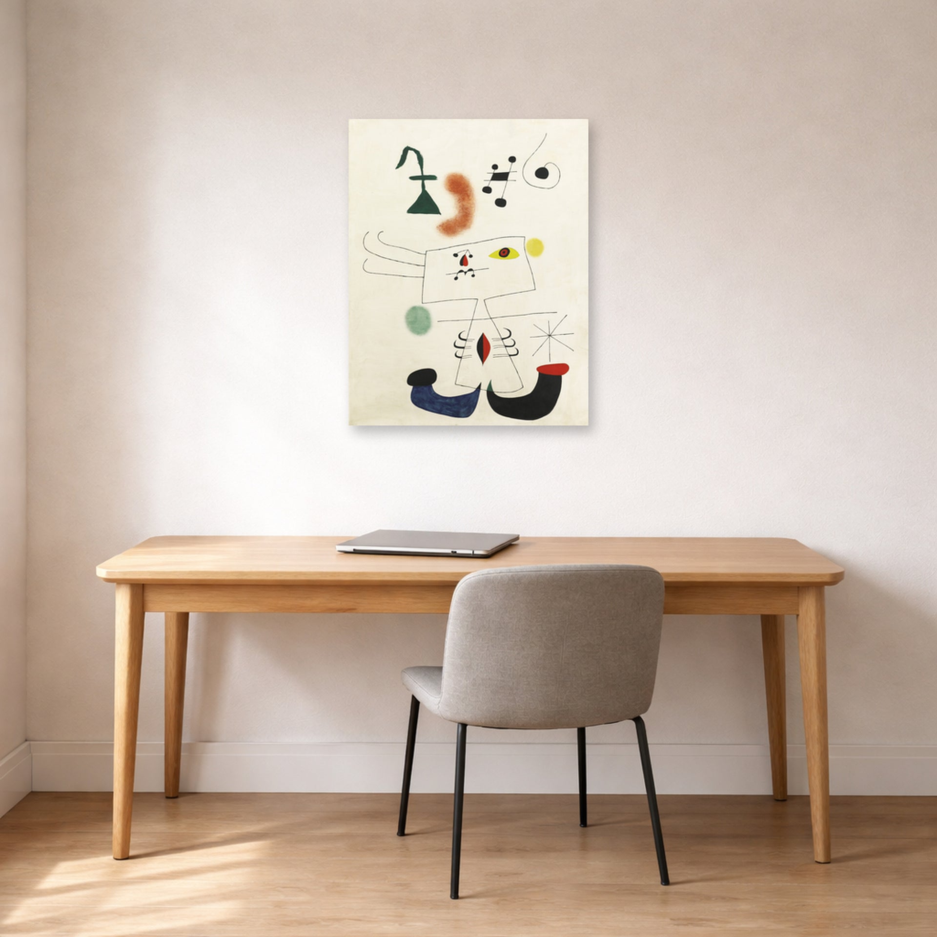 Unframed poster print of Joan Miró's 'Emme Revant De L'evasion' displayed on a wall in a office