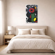 Gallery-wrapped canvas print of Joan Miró's 'Fascinating Character' displayed on a wall in a bedroom