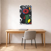 Unframed poster print of Joan Miró's 'Fascinating Character' displayed on a wall in a office