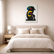 Gallery-wrapped canvas print of Joan Miró's 'La Brahmane' displayed on a wall in a bedroom