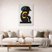 Gallery-wrapped canvas print of Joan Miró's 'La Brahmane' displayed on a wall in a living room