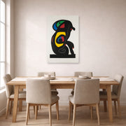 Unframed poster print of Joan Miró's 'La Brahmane' displayed on a wall in a dining room